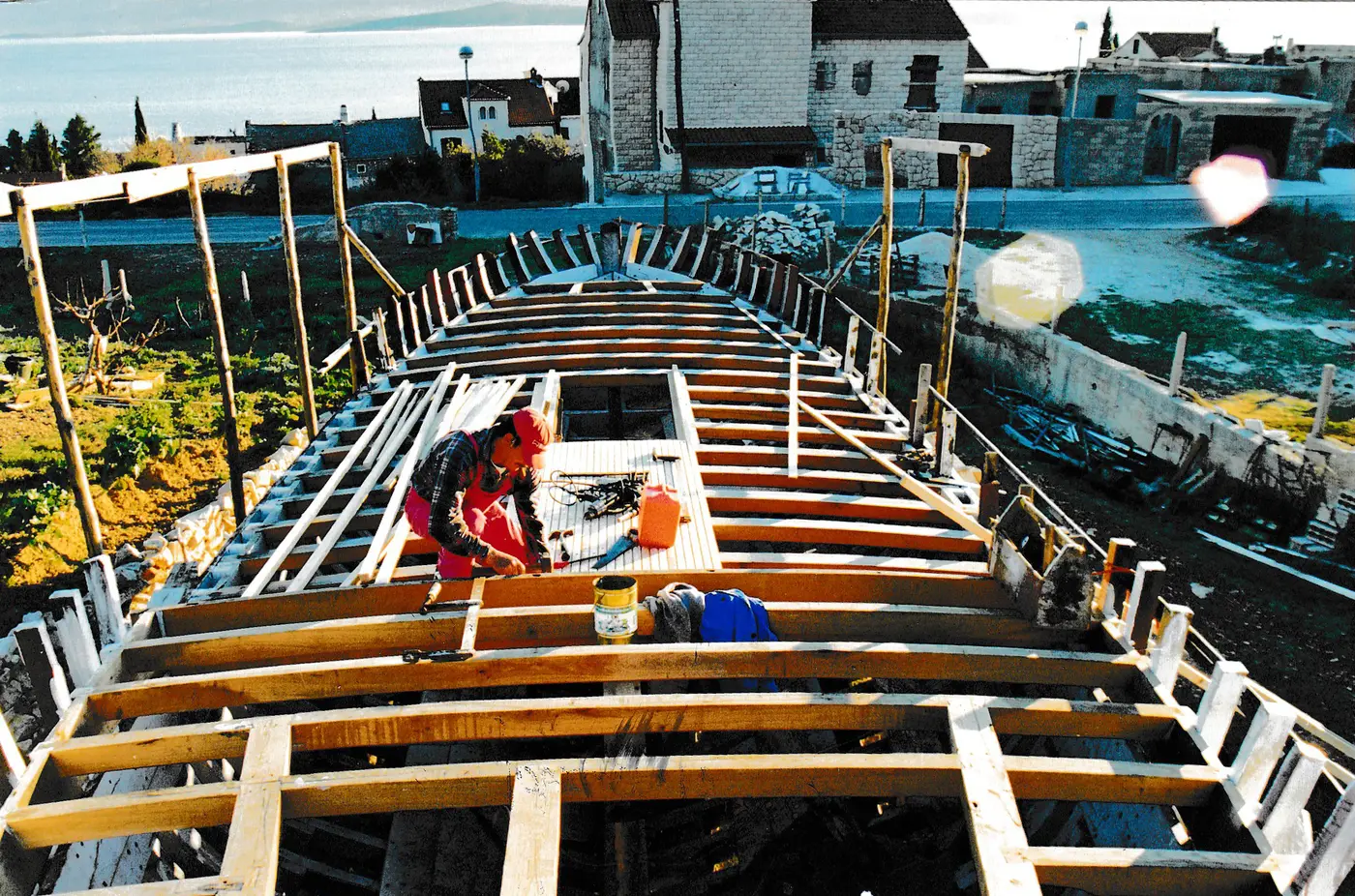 Framing the deck with Bol and the sea behind