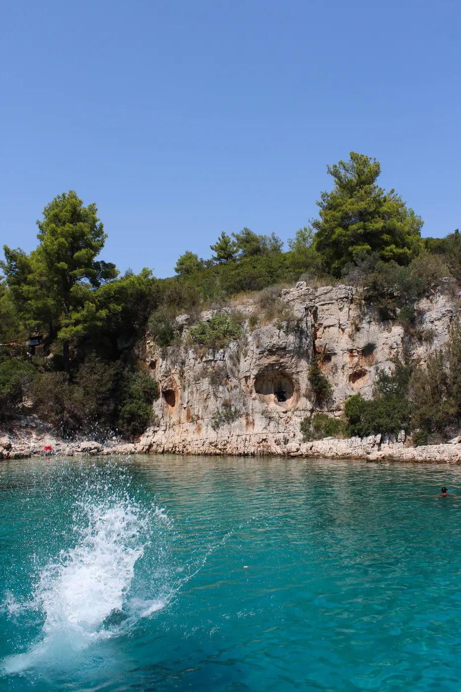 Splashing into the sea by the cove caves