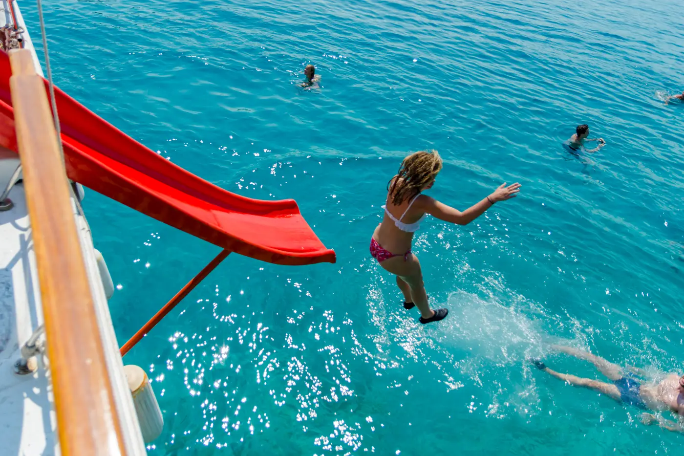 Guest jumping off the boat slide