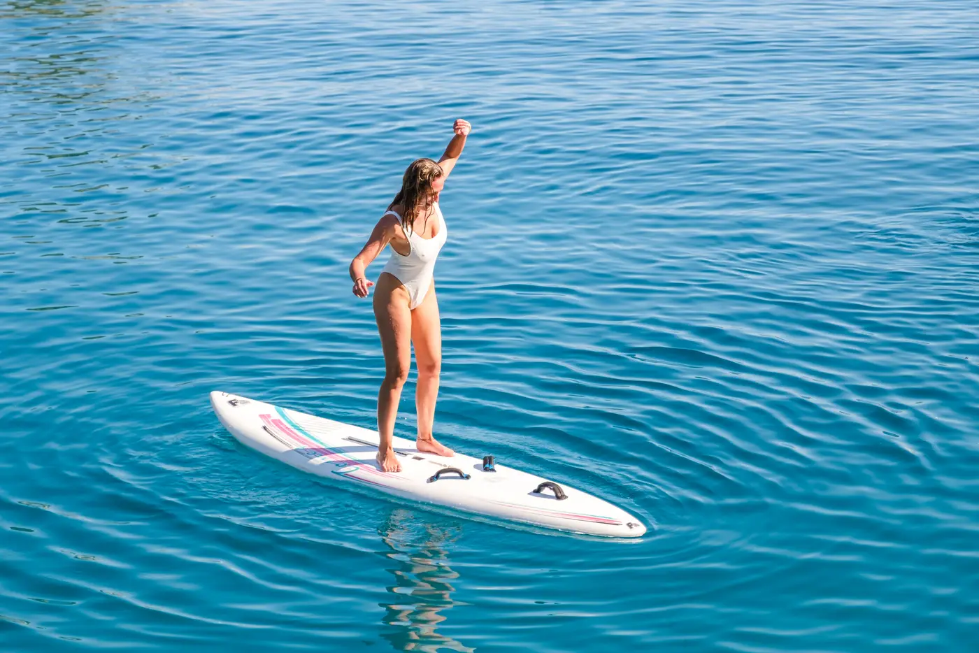 Guest cheering on a paddleboard